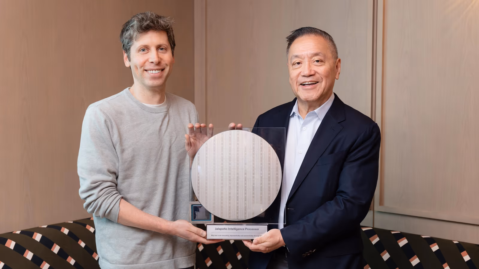 OpenAI CEO Sam Altman and Broadcom chairman and CEO Hock Tan holding a wafer of the Jalapeño Intelligence Processor.