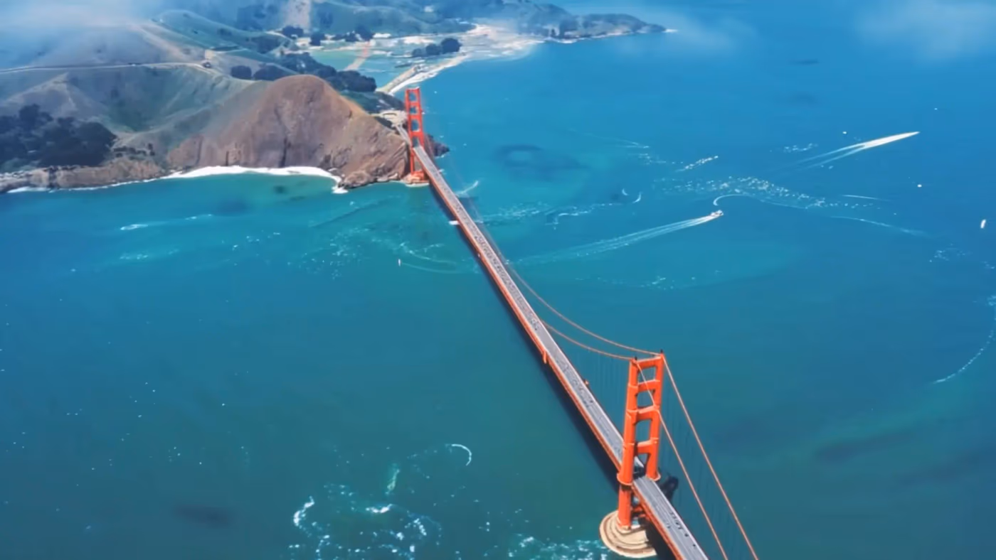 Aerial drone-style camera-controlled video generated by Atlas, showing the Golden Gate Bridge and San Francisco Bay coastline from above, demonstrating precise, geometry-driven camera movement.